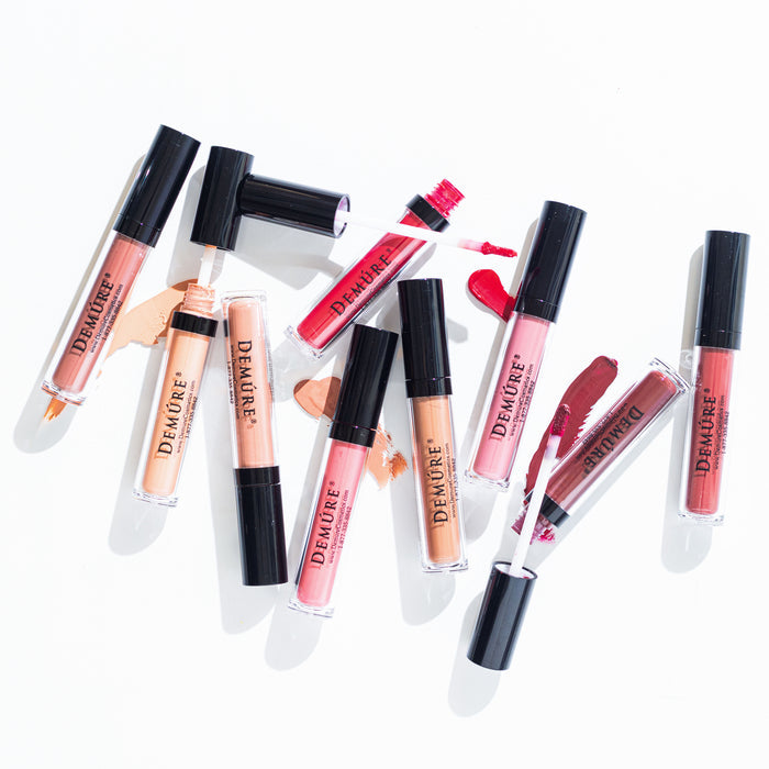 Bird's eye view image of Demure Matte Lipstick colors  with swatches of four of the colors.