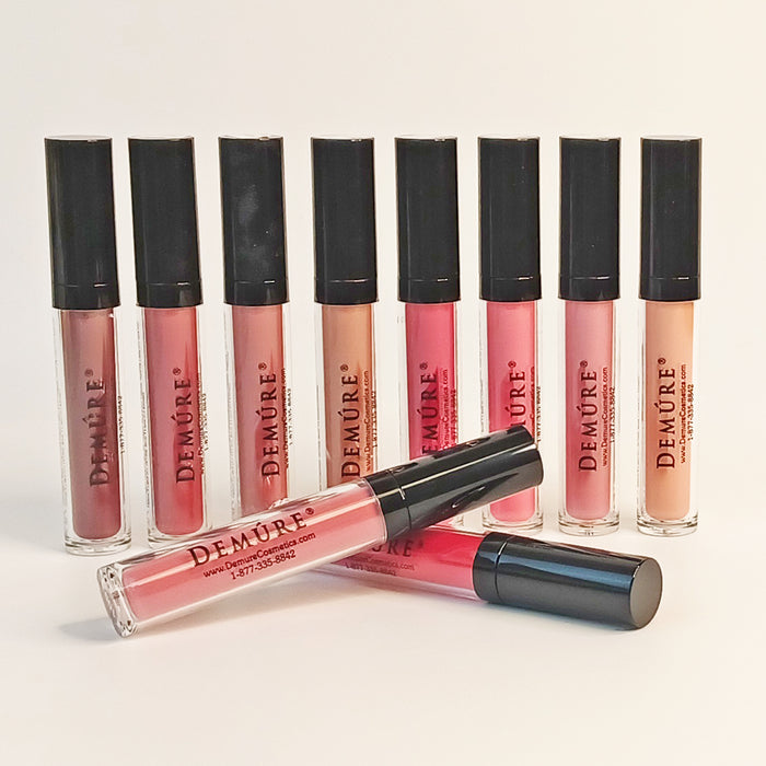 Image of Demure Matte Lipstick colors in a row, with two colors in front crisscrossed