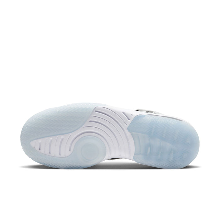 Outsole view of black-and-white high-top basketball shoes with light blue tread