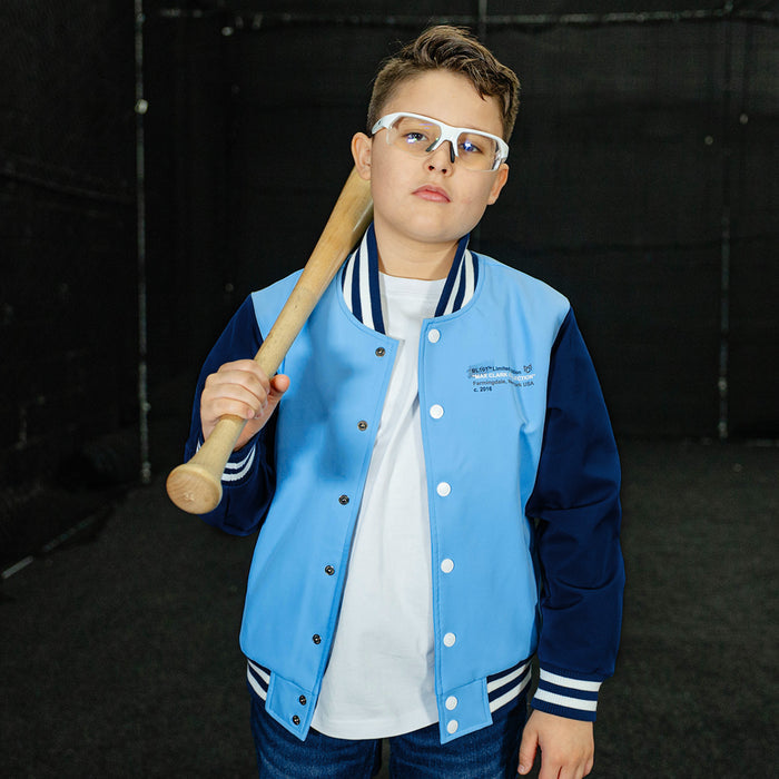 Youth model wearing blue Max Clark Bomber youth bomber