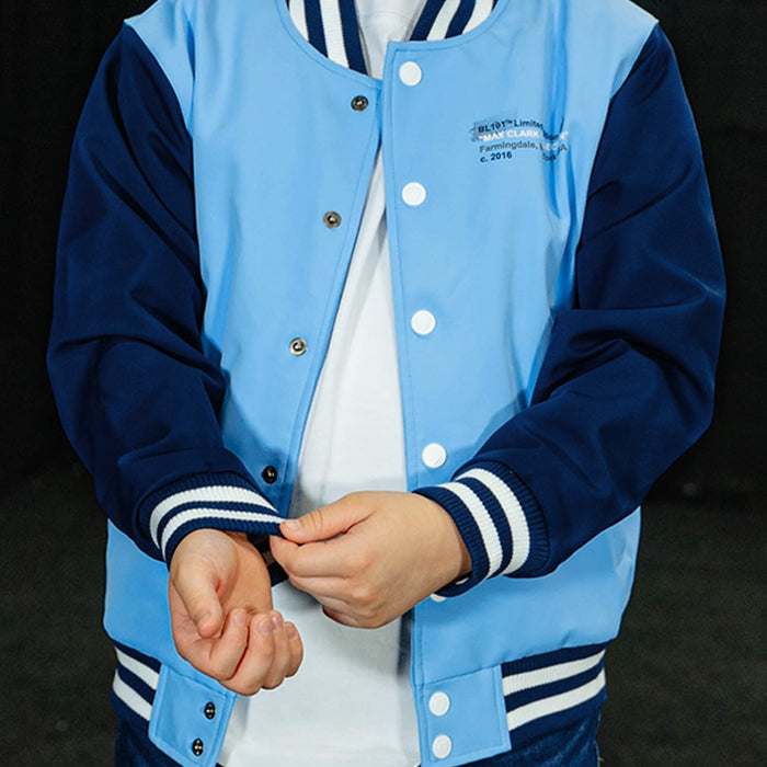 Youth model wearing blue Max Clark Bomber youth bomber