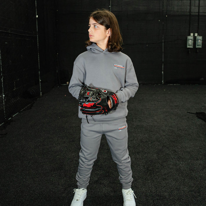 Youth model wearing gray Max Clark youth sweatpants
