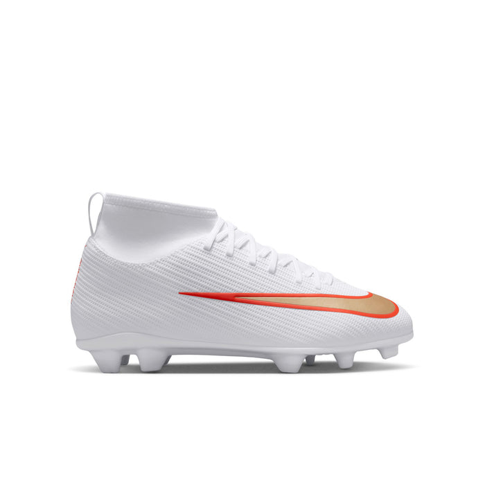 Youth soccer cleats, white with orange Nike swoosh, FG/MG studs