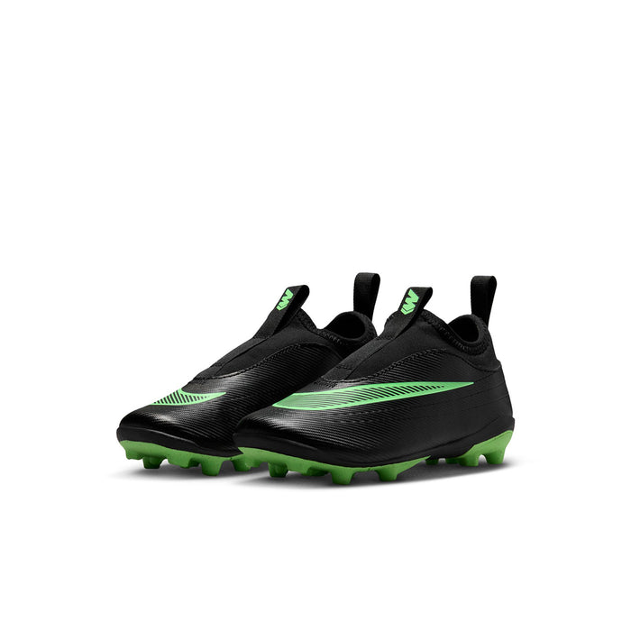 Kids black soccer cleats, side view with green stripes and molded traction studs