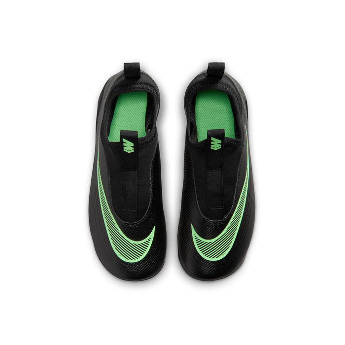 Kids black cleats with green interior lining and laced tongue opening