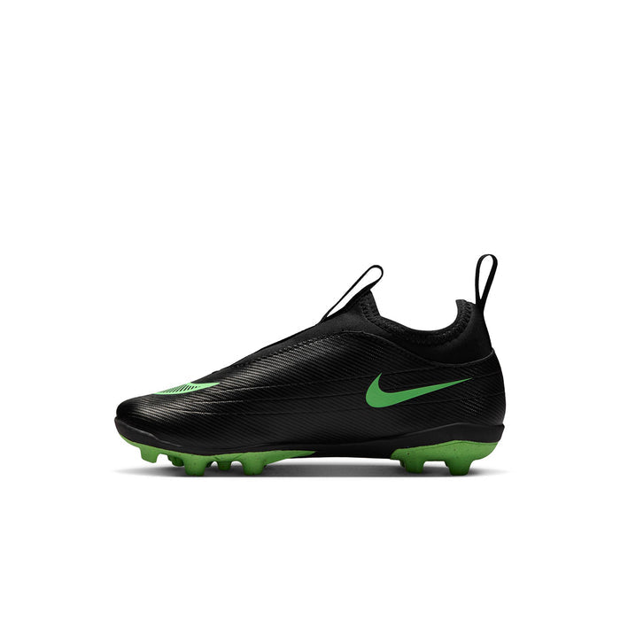 Kids black low-top soccer cleat with green stripe details and molded studs