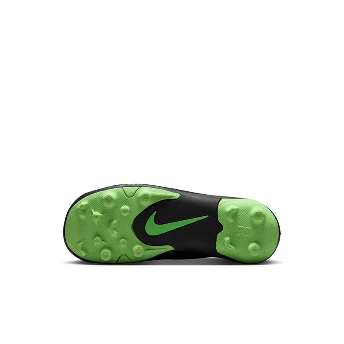 Kids black cleat sole view with green rubber outsole and molded stud pattern