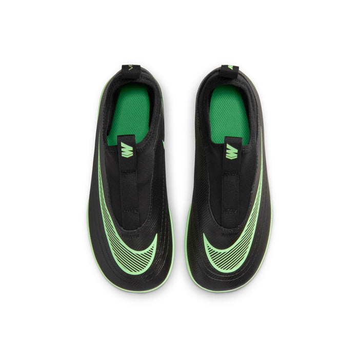 Kids black soccer cleats with bright green Nike Swoosh and neon outsole accents