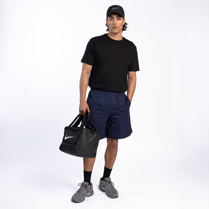 Men's navy woven shorts on model, elastic waist and side seam detail.