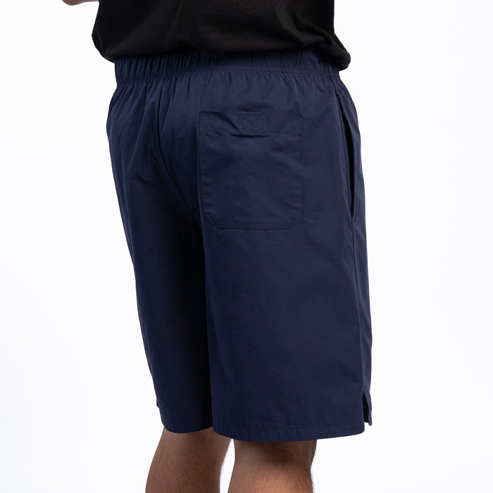 Men's navy woven shorts, back view with patch back pocket and elastic waist.