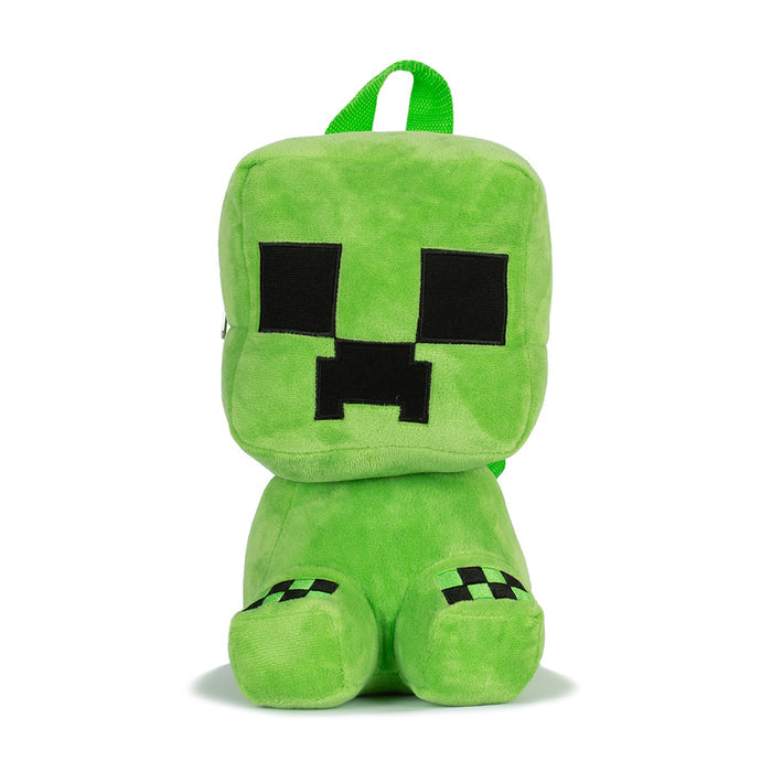 Green plush backpack with Minecraft-style face and black square eyes; front loop straps