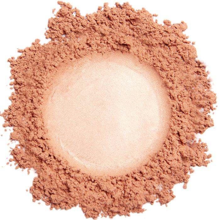 A close up swatch of Demure Bloom mineral blush