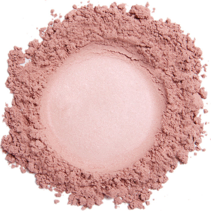 A close up swatch of Demure Hint of Pink mineral blush
