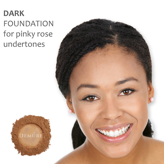 A photo of a woman wearing Demure Dark foundation for pinky rose undertones