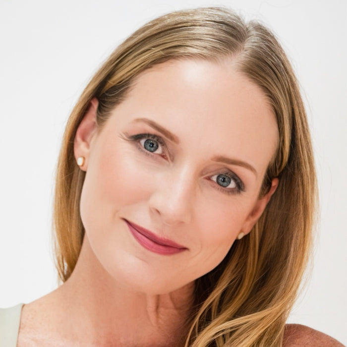 Woman wearing Demure Light Warm Foundation