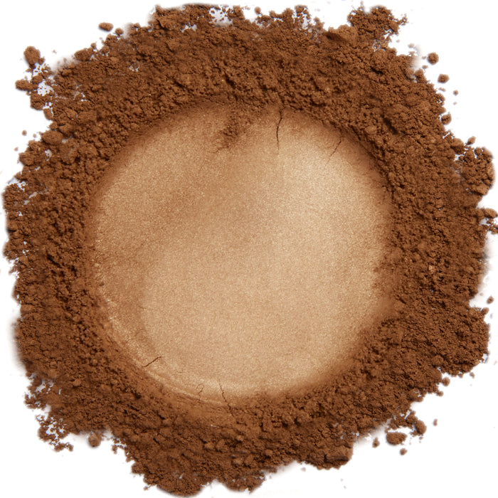 A close up swatch of Demure Spiced Honey mineral foundation