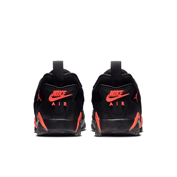 Back view of black sneakers with red-orange Nike Air heel logo, lace-up build