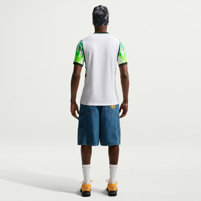 White Nigeria away replica football jersey with green accents; short sleeves, black trim.
