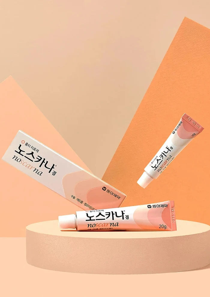Three tubes of Noskana lip balm on a peach-colored platform with an orange geometric background