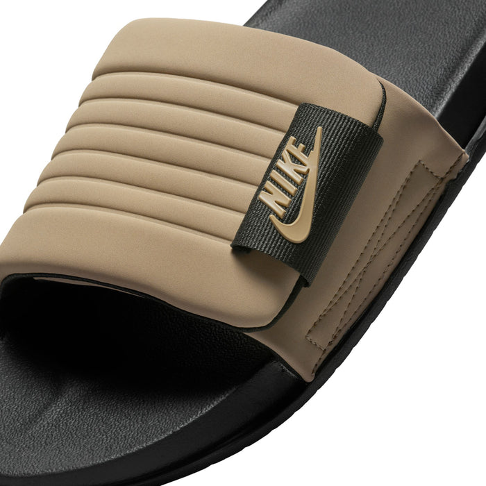 Close-up of men's tan slide sandal strap with ribbed band and Nike logo patch
