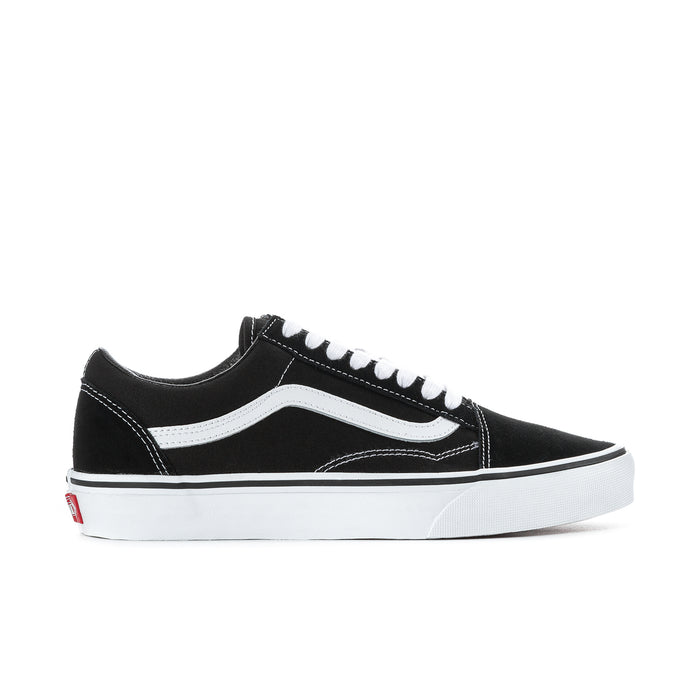 Black low-top sneakers with white side stripe and white lace-up closure