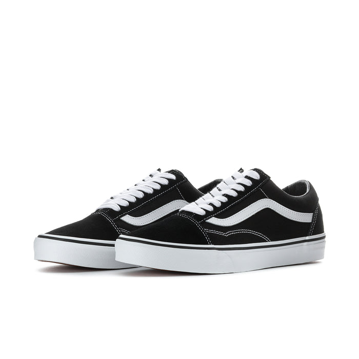 Black low-top sneakers with white side stripe, stitched details, and white laces