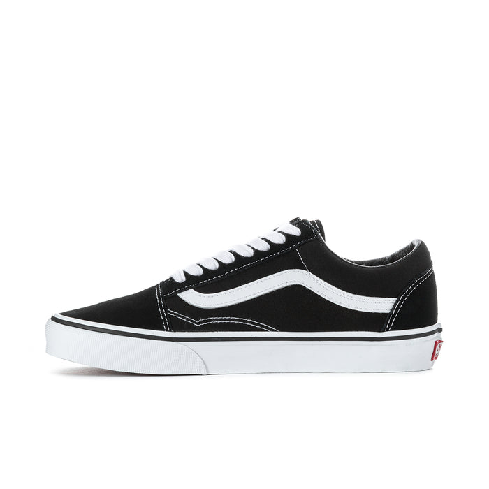 Black low-top sneakers with white heel tabs and white cupsole