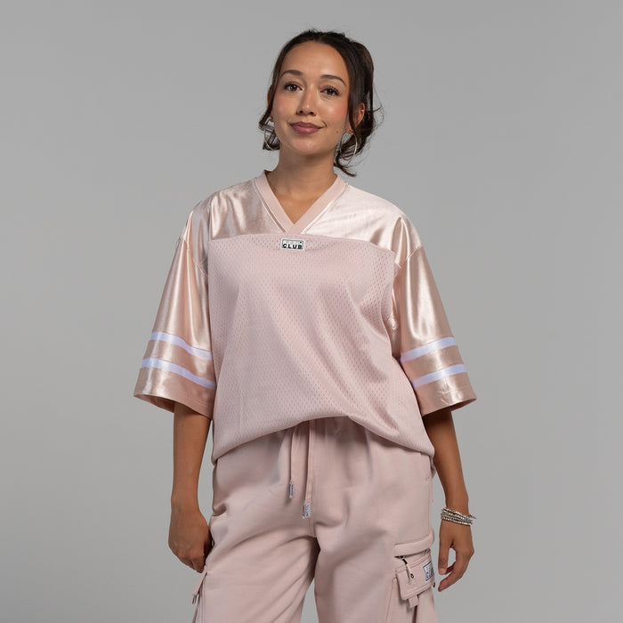 Womens oversized football jersey in sepia rose with V-neck and white striped sleeves