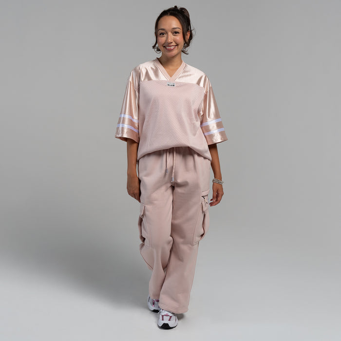 Womens oversized football jersey in sepia rose with V-neck and breathable perforated pattern