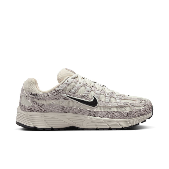 Women's Nike running sneaker in light bone with gray snakeskin-texture overlays