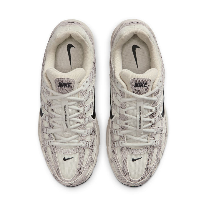 Women's Nike sneakers, light bone laces and tongue with black swoosh accents