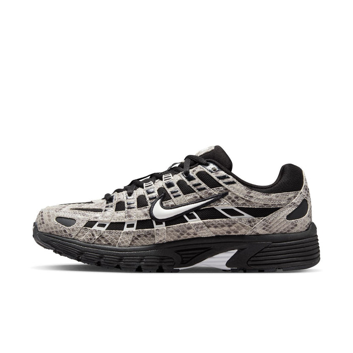Women’s athletic sneaker side view in snakeskin print with black swoosh and sole