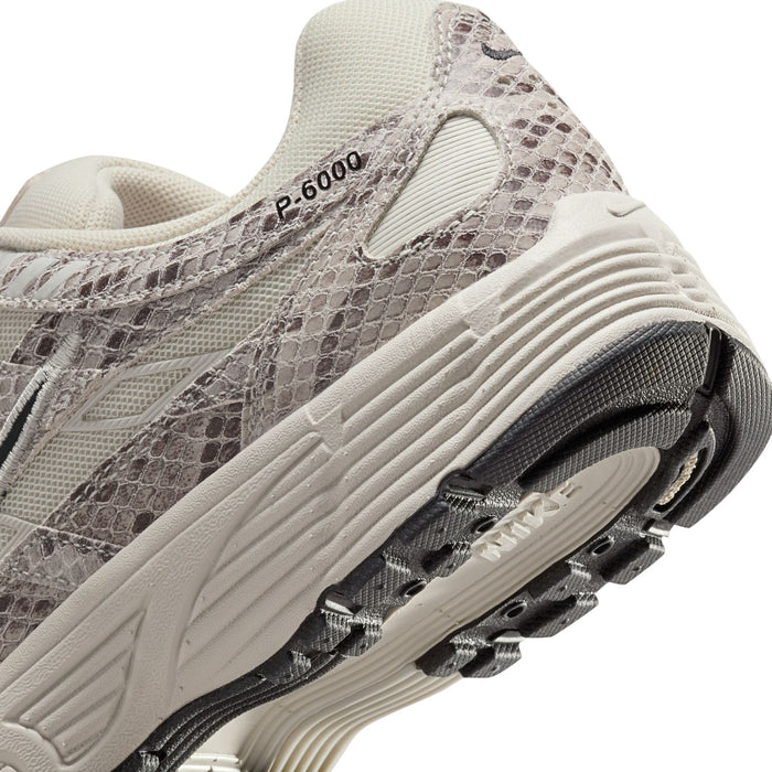 Women's Nike P-6000 sneaker close-up, light bone mesh with gray snakeskin texture