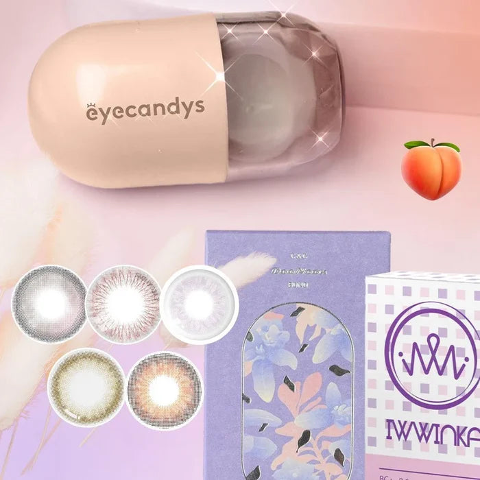 A pastel display shows EyeCandys colored contacts in cases, a peach emoji, the Peach Fuzz Bundle (5 Pairs), a lavender floral box, and a purple checkered “IWWINK” box. A beige and purple lens case labeled “EyeCandys” sits on top.