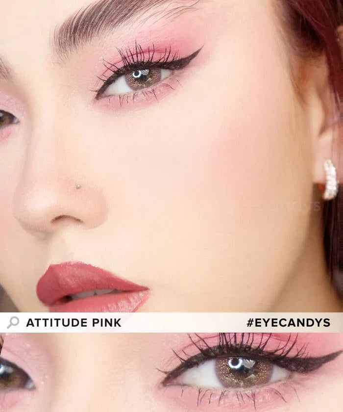 Close-up of a woman with dramatic pink eye makeup, winged liner, bold lashes, and vibrant pink lips. She wears EyeCandys Peach Fuzz Bundle (5 Pairs) non-prescription contacts for a striking look, plus a nose stud and jeweled earring. #EYECANDYS.