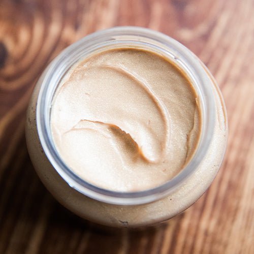 An overhead shot of the Beekman 1802 Supersized goat milk pot of gold whipped body cream.