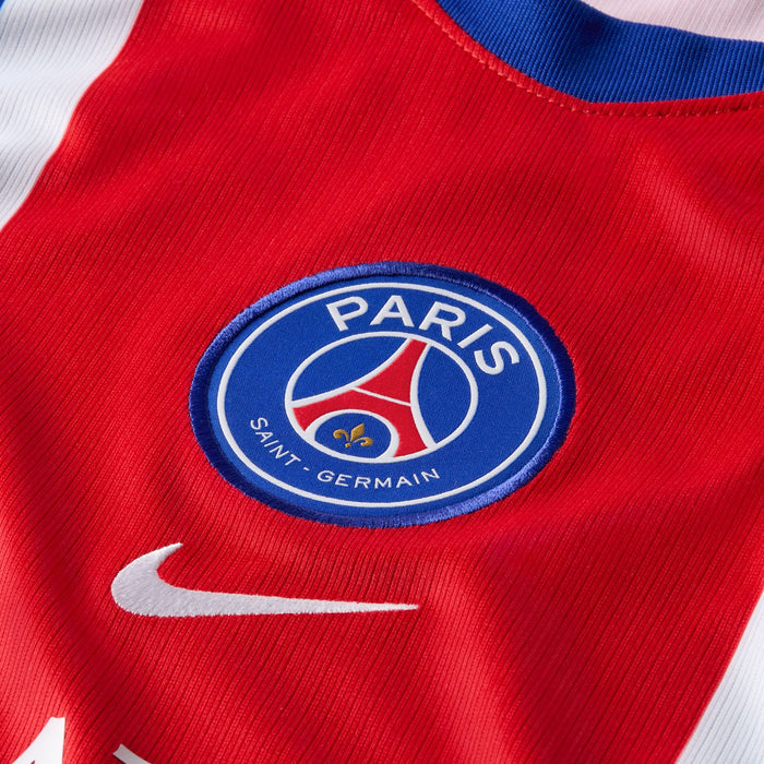 PSG crest and Nike swoosh on red center stripe of the PSG home stadium jersey