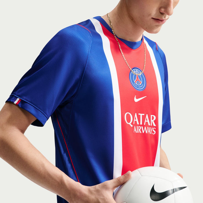 Men's PSG home stadium replica jersey detail, blue sleeves with red center and Qatar Airways