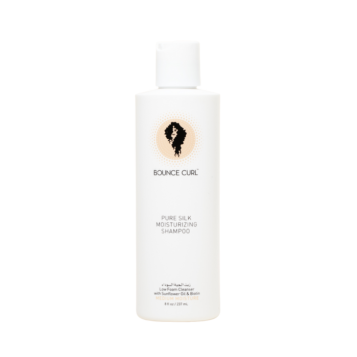 A bottle of Bounce Curl Pure Silk Moisturizing Shampoo