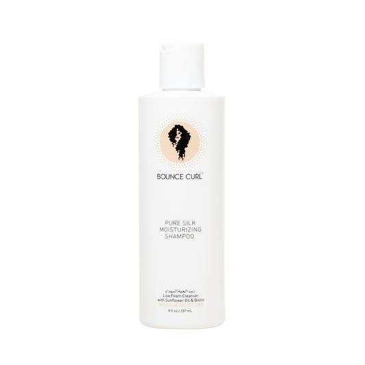 A bottle of Bounce Curl Pure Silk Moisturizing Shampoo