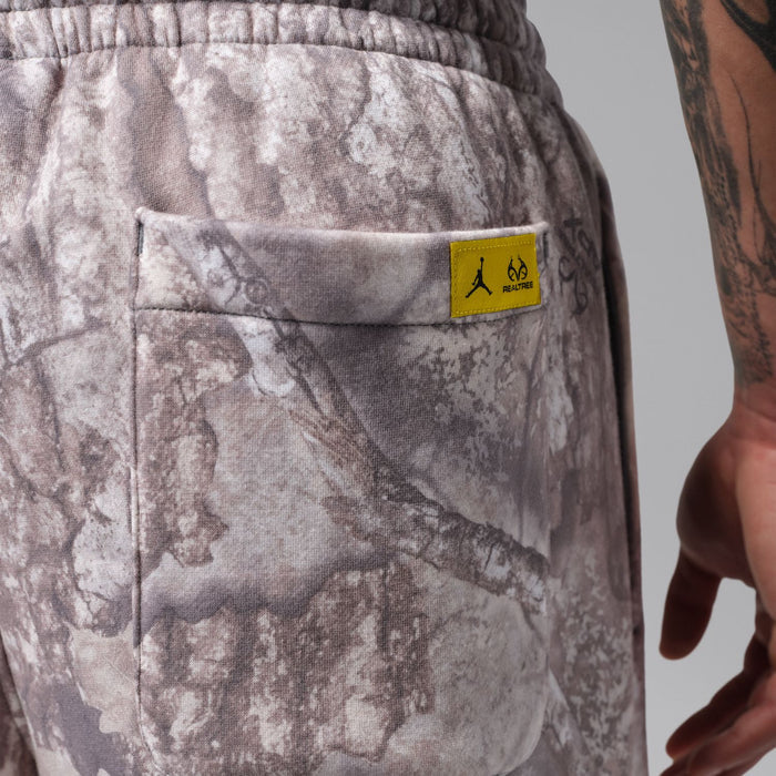 Realtree men's camo open-hem pants with rectangular logo patch on front pocket