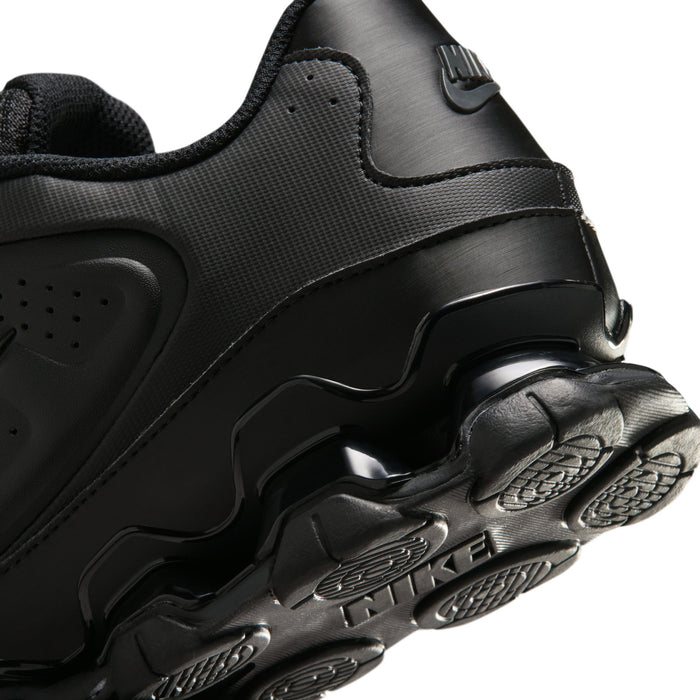 Men's black Nike sneaker close-up with cushioned collar and chunky heel tread
