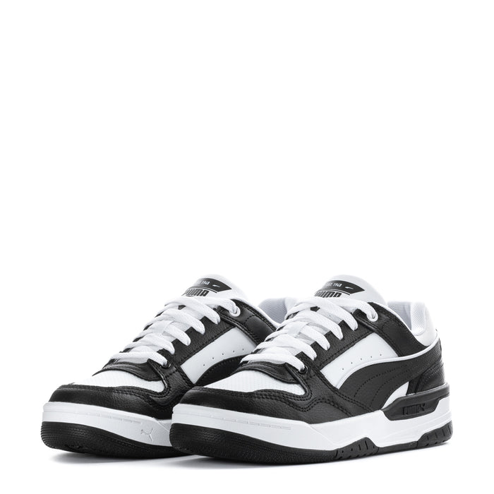 Youth low-top sneakers, pair shown, black uppers with white toe and laces