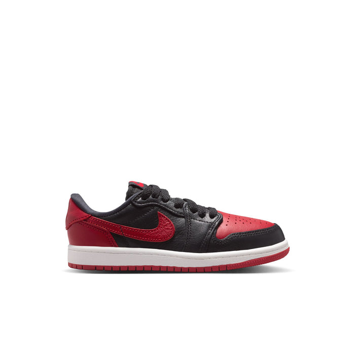 Kids low-top sneakers in black and red, with red swoosh and lace-up front.