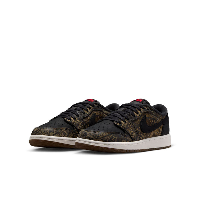 Youth low-top sneakers, side view; black and gold patterned uppers with red details