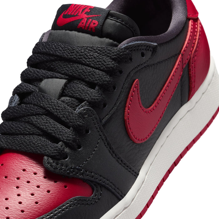 Youth sneaker heel and lace area, black upper with red Nike AIR branding