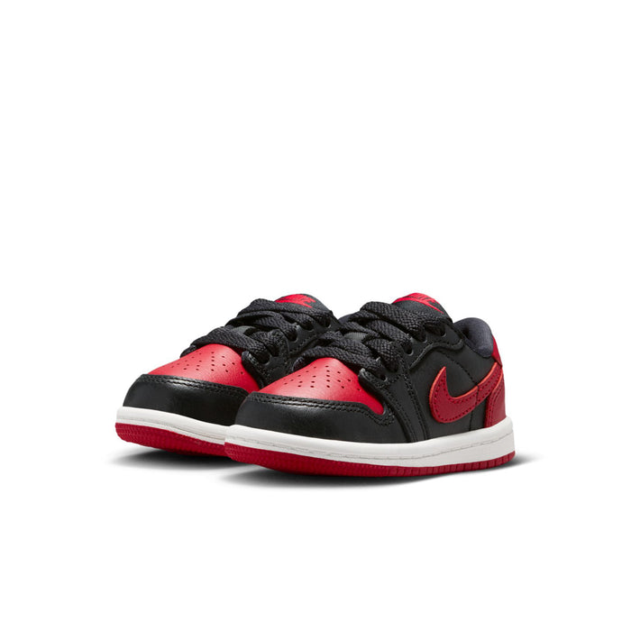 Pair of toddler low-top sneakers in black and red with white rubber sole