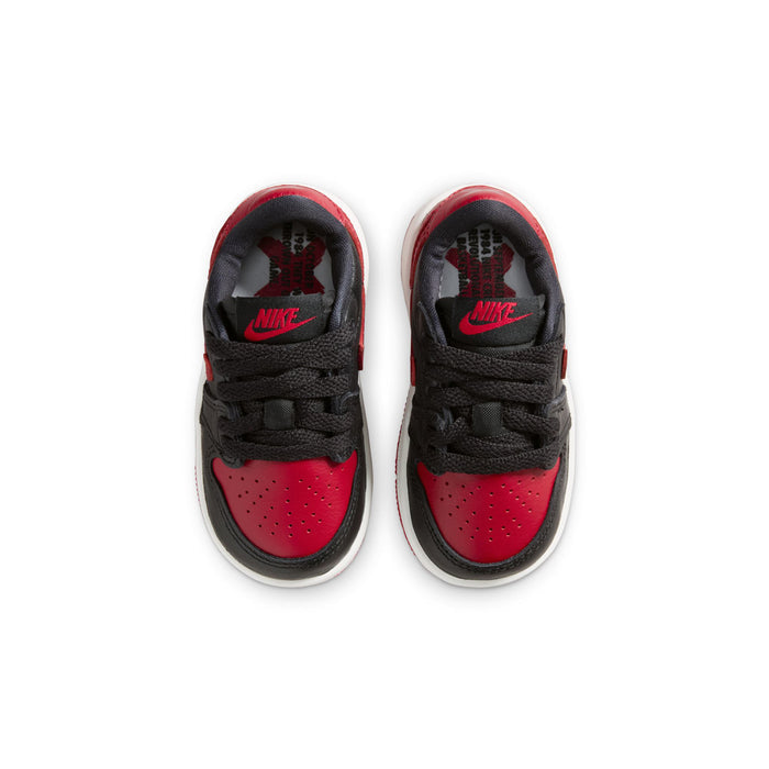 Toddler low-top sneakers with red-and-black insoles and Nike branding