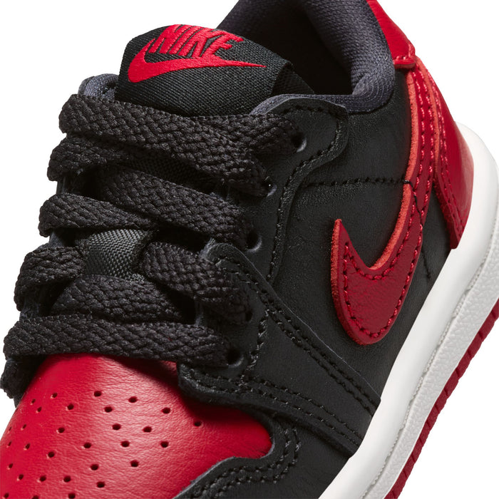 Toddler sneaker upper close-up, black with red swoosh and black laces