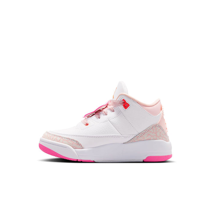Kids' sneaker side profile in white with pink laces and patterned panel, bright pink sole.